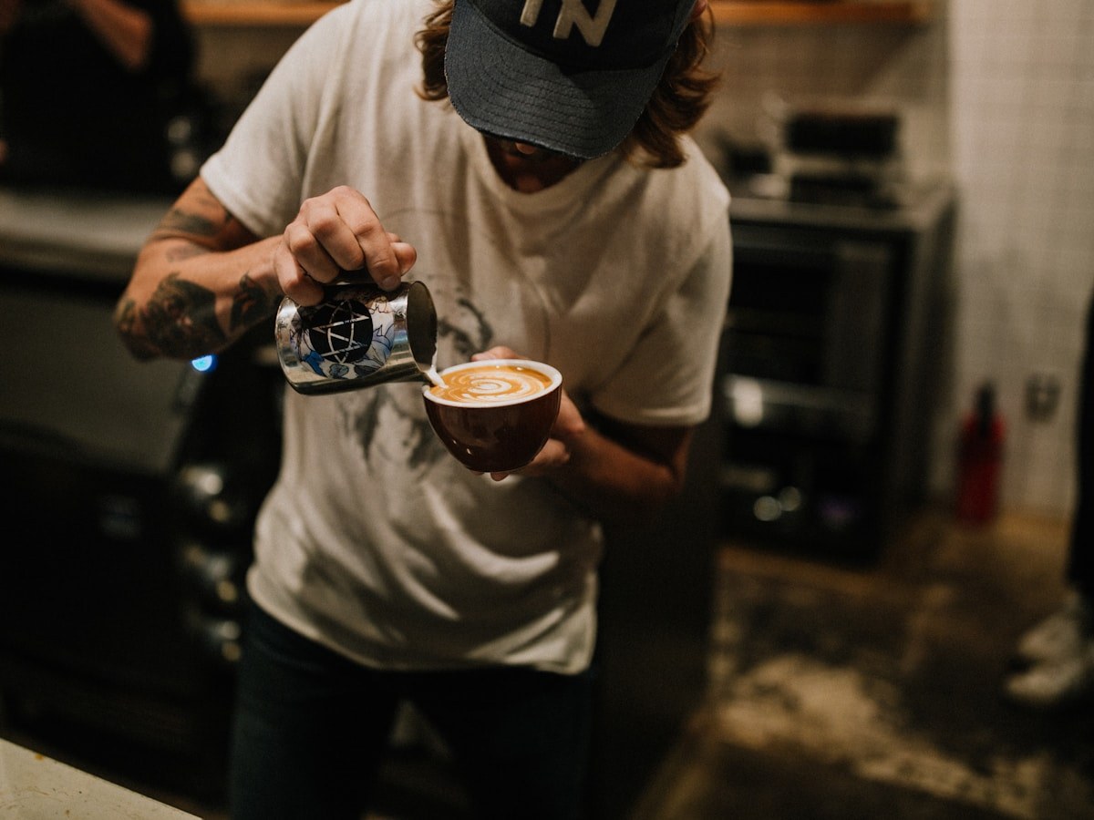 Cafe barista preparing coffee